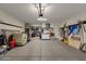 Spacious garage with ample storage shelving and room for vehicles at 7635 W Rock Springs Dr, Peoria, AZ 85383