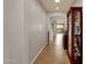 View down a hallway showcasing tile flooring and a display cabinet at 7635 W Rock Springs Dr, Peoria, AZ 85383