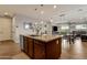 Kitchen island with granite countertops and seating at 7635 W Rock Springs Dr, Peoria, AZ 85383