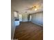 A bright living room with wood floors and ceiling fan at 8023 E Irwin Ave, Mesa, AZ 85209