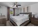 Cozy bedroom with a ceiling fan, natural light, and neutral decor at 8024 E Hubbell St, Scottsdale, AZ 85257
