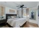 Serene bedroom featuring a ceiling fan, modern decor, natural light, and a large bed with plush pillows at 8024 E Hubbell St, Scottsdale, AZ 85257