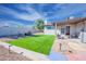 Artificial turf backyard with patio and seating area at 8413 E Sheridan St, Scottsdale, AZ 85257