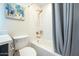 Bathroom with tub, gray shower curtain, and modern vanity at 8413 E Sheridan St, Scottsdale, AZ 85257