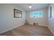 Bright bedroom with hardwood floors and ceiling fan at 8413 E Sheridan St, Scottsdale, AZ 85257