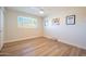 Bright bedroom with wood-look floors and a ceiling fan at 8413 E Sheridan St, Scottsdale, AZ 85257