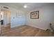 Bedroom with hardwood floors, ceiling fan, and ensuite access at 8413 E Sheridan St, Scottsdale, AZ 85257