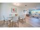 Elegant dining area with glass table, grey chairs, and hardwood floors at 8413 E Sheridan St, Scottsdale, AZ 85257