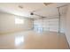 Spacious garage with an insulated door and epoxy floor at 8413 E Sheridan St, Scottsdale, AZ 85257