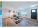 Bright living room featuring hardwood floors and a cozy seating area at 8413 E Sheridan St, Scottsdale, AZ 85257