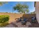 Private backyard featuring a stone patio and desert landscaping at 852 E Gary Ln, Phoenix, AZ 85042