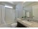 Bathroom with a shower-tub combination, a granite counter and a large mirror at 852 E Gary Ln, Phoenix, AZ 85042