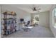 Bedroom with ceiling fan, carpet, and a view of desert landscaping outside the window at 852 E Gary Ln, Phoenix, AZ 85042