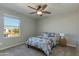 Bedroom with carpeted floors, a light gray paint color, and an outside view at 852 E Gary Ln, Phoenix, AZ 85042