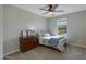 Bedroom with carpeted floors, a light gray paint color, and a view outside the window at 852 E Gary Ln, Phoenix, AZ 85042