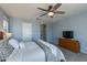 Comfortable bedroom features a ceiling fan, carpeted floor, and soft, neutral wall color at 852 E Gary Ln, Phoenix, AZ 85042