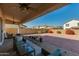 Covered patio with outdoor seating and views of the expansive backyard at 852 E Gary Ln, Phoenix, AZ 85042