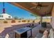 Covered patio with a ceiling fan and a view of the spacious backyard at 852 E Gary Ln, Phoenix, AZ 85042