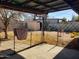 Backyard with covered patio, storage shed, and chain link fence at 921 S Pioneer --, Mesa, AZ 85204