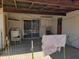 Backyard with covered patio, sliding glass door, and laundry hookups at 921 S Pioneer --, Mesa, AZ 85204