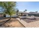 Exterior home view with a decorative patio, landscaping, walkway, and desert landscaping at 9618 W Appaloosa Dr, Sun City, AZ 85373