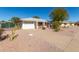 Charming home featuring a low-maintenance rock yard and a convenient two-car garage at 9618 W Appaloosa Dr, Sun City, AZ 85373