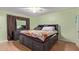 Bedroom with large bed and built-in storage at 10126 W Sun City Blvd, Sun City, AZ 85351