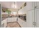 White kitchen with ample counter space and storage at 10126 W Sun City Blvd, Sun City, AZ 85351