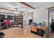 Home office with wood floors and built-in shelving at 10126 W Sun City Blvd, Sun City, AZ 85351