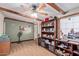 Home office with built-in shelving and hardwood floors at 10126 W Sun City Blvd, Sun City, AZ 85351