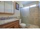 Updated bathroom features tiled walk-in shower, modern vanity with granite countertop at 1064 S 81St Pl, Mesa, AZ 85208