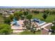 Aerial view of a neighborhood park featuring a playground and expansive green space at 11050 E Ravenna Ave, Mesa, AZ 85212