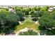 Amphitheater in a park with tiered seating and surrounded by trees at 11050 E Ravenna Ave, Mesa, AZ 85212