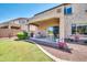 Landscaped backyard with patio, providing ample outdoor space at 11050 E Ravenna Ave, Mesa, AZ 85212