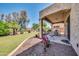 Covered patio and grassy backyard at 11050 E Ravenna Ave, Mesa, AZ 85212