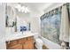 Bathroom with tub, shower, and vanity at 11050 E Ravenna Ave, Mesa, AZ 85212