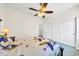 Bedroom with large closet and ceiling fan at 11050 E Ravenna Ave, Mesa, AZ 85212