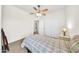 Bedroom with a ceiling fan and window at 11050 E Ravenna Ave, Mesa, AZ 85212
