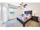 Bedroom with dark wood furniture and window at 11050 E Ravenna Ave, Mesa, AZ 85212