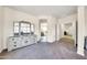 Bright bedroom with access to the bathroom and carpet flooring at 11050 E Ravenna Ave, Mesa, AZ 85212