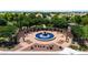 Community area featuring a central fountain surrounded by a pergola and landscaping at 11050 E Ravenna Ave, Mesa, AZ 85212