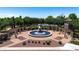 Elegant community fountain with pergola and landscaping; ideal for relaxing at 11050 E Ravenna Ave, Mesa, AZ 85212