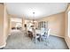 Bright dining room with a large table and hutch at 11050 E Ravenna Ave, Mesa, AZ 85212