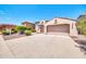 Two-story house with a two-car garage and desert landscaping at 11050 E Ravenna Ave, Mesa, AZ 85212