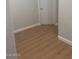 Hallway with wood-look flooring and white trim at 11050 E Ravenna Ave, Mesa, AZ 85212