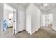 Bright hallway with access to multiple rooms at 11050 E Ravenna Ave, Mesa, AZ 85212