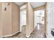 Long hallway with tile floors and access to other rooms at 11050 E Ravenna Ave, Mesa, AZ 85212