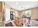Eat-in kitchen with island, granite counters, and stainless steel appliances at 11050 E Ravenna Ave, Mesa, AZ 85212