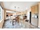Bright kitchen with an island, stainless steel appliances, and breakfast nook at 11050 E Ravenna Ave, Mesa, AZ 85212