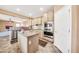 Modern kitchen with island, stainless steel appliances, and granite countertops at 11050 E Ravenna Ave, Mesa, AZ 85212